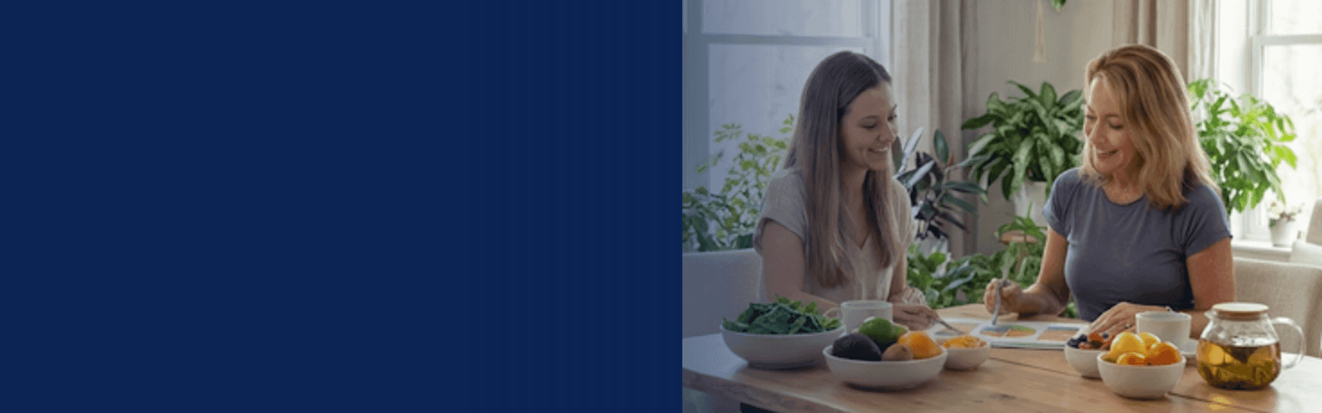 Nutritional therapy consultation — two women discussing a nutrition plan at a table with fresh foods